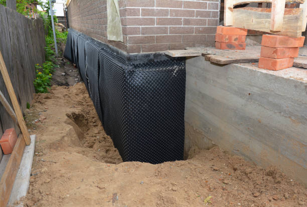 SJ Waterproofing Pros technician performing targeted Emergency Waterproofing assessment in Bradyville, TN